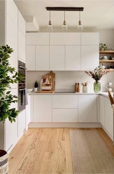 the kitchen is clean and ready for us to use it's natural wood flooring