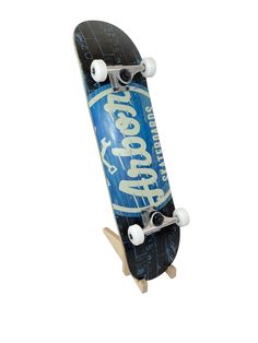 a blue skateboard with white wheels on it