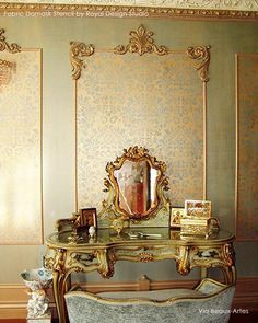 an ornate vanity and mirror in the corner of a room