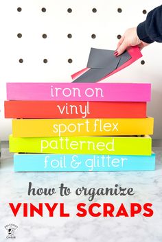 a stack of books with the title how to organize vinyl scraps on it and an image of a hand holding a piece of paper