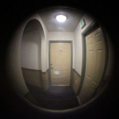 an image of a door in the middle of a hallway