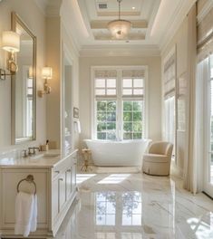 a large bathroom with marble flooring and white walls, along with an oval tub in the center