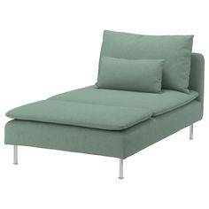 a green couch with two pillows on the back and one arm folded over it's head