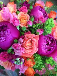 a bouquet of colorful flowers sitting on top of a table