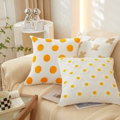 the pillows on the couch are all different colors and patterns, but one is white with yellow polka dots