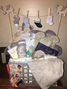 a basket filled with baby items sitting on top of a table