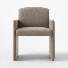 an upholstered chair with a curved back and armrest, viewed from the side