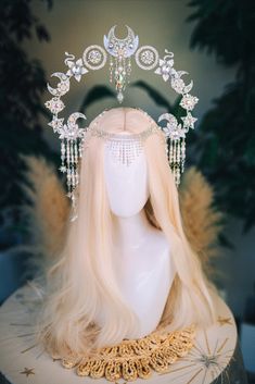 The silver headpiece is inspired by the moon, sun and stars, and is made of Czech pearls. The crown will be suitable for an important event, the theater, a festival, a ball or a wedding.