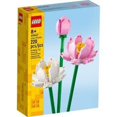 two pink lego flowers are in the box