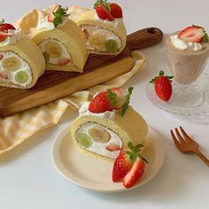 some fruit rolls are on a plate with strawberries