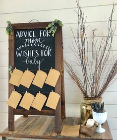 a sign that says advice for mom wishes for baby next to some flowers and other items