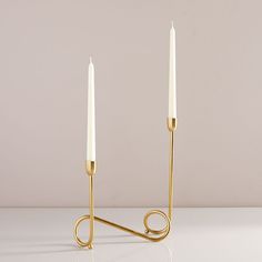 a pair of candles sitting on top of a table