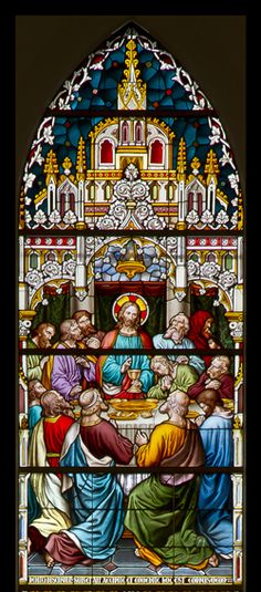 a stained glass window depicting the last supper