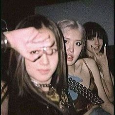 three young women sitting next to each other