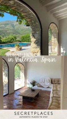 an open living room with arched windows and a view of the mountains in valalena spain