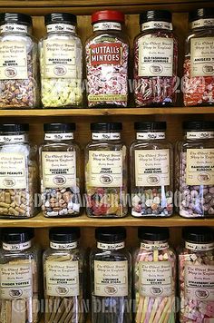 many jars filled with different types of candies