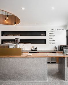 an empty counter in a restaurant with lots of windows