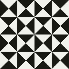 a black and white pattern with triangles