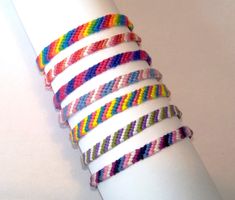 a stack of bracelets on top of a white napkin