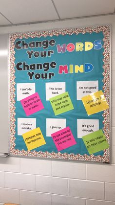 a bulletin board that says change your words, change your mind