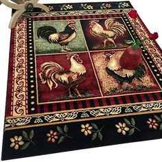 an area rug with roosters and apples on it