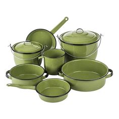 green pots and pans are stacked on top of each other