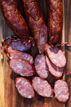 sliced sausages on a cutting board with candy canes