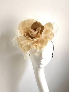 Large gold flower hat This amazing large gold flower hat is made from organza and velvet fabric. The hat sits on the black fabric-covered headband to which I attached small round sinamay base and  a comb so it will sit steadily on your hair. A large gold flower hat will be an amazing accessory to compliment your outfit. It will fit the average head size. You can wear this amazing hat at the wedding, Christening, Horse races, and any other special occasion. Enjoy and please have a look in my shop Gold Curved Brim Costume Hat For Summer, Gold Round Crown Headpiece For Weddings, Gold Wedding Headpiece With Round Crown, Gold Curved Brim Hat For Kentucky Derby, Gold Mini Hat For Spring Evenings, Gold Mini Hat For Evening In Spring, Gold Mini Hat For Spring Evening, Gold Evening Hat For Spring, Gold Party Hats For Spring