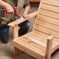 a man sanding up a wooden chair with two drillers on the armrests