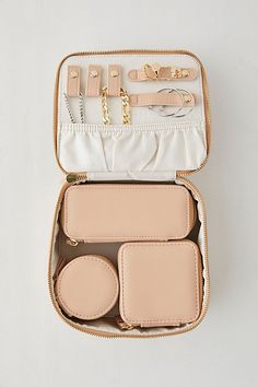 Stow your twinkling treasures when you travel with this jewelry case from Mele and Co Crafted from vegan leather lined with anti-tarnish microsuede, this jewelry case offers a variety of storage solutions for your twinkling treasures. Equipped with three smaller jewelry cases that rest inside one larger box. The lid of the larger case features shirred catch pockets with 5 snap-down straps. Features Bento-style jewelry case from Mele and Co Crafted from vegan leather lined with anti-tarnish microsuede 3 Small cases 1 Large case equipped with shirred pockets and snap-down straps Content + Care Includes 4 jewelry cases Sueded fabric, polyurethane/fiberboard, gold tone Wipe clean Imported Size Box 1 dimensions: 7" l x 6.25" w x 3.13" h Box 2 dimensions: 5.75" l x 2.5" w x 2.25" h Box 3 dimensi Bento, Jewelry Cases, Travel Jewelry Box, Small Case, Travel Jewelry, Small Jewelry, Jewelry Case, Style Jewelry, Box Set