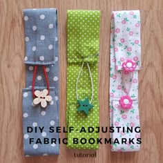 three folded fabric bookmarks with flowers and stars on them