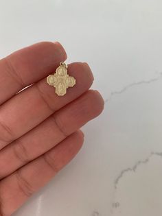 Medium 14K Solid Gold Cross | Yellow Gold Cross | Catholic Pendant | 14K Solid Gold Cross Christian Pendant | Four Saint Cross⁙ Materials: 14K Yellow Gold⁙ Dimensions: 16MM Height by 14MM Width in diameter ⁙ The opening of the ring (jump ring) is 2.5MM wideProduction Times:⁙ Order processing time varies between 1-3 business days⁙ All orders placed on Saturday, Sunday, or on a national holiday will begin processing the following business day Cross Christian, National Holiday, National Holidays, Gold Cross, Saturday Sunday, Religious Jewelry, Sacred Heart