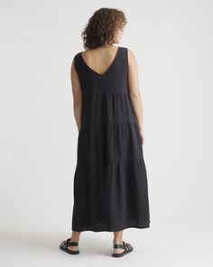 The ultimate slip on and step out style, this easy-to-wear dress still packs a fashionable punch. Made of breezy, lightweight organic cotton gauze, it features a v-neck in the front and back and flowy tiered bodice. Slide into a pair of sandals and top with a few pieces of jewelry and you’ve got a full look.  | Quince | Women's Gauze Tiered Maxi Dress in Black, Size XS, Organic Cotton Comfy Summer Dresses, Gauze Maxi Dress, Wide Leg Linen Pants, Full Look, Cotton Midi Dress, Tiered Maxi Dress, Organic Fabrics, Lovely Dresses, Flowy Dress