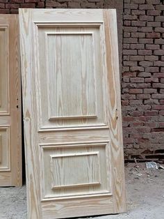 two unfinished doors sitting next to each other