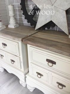 two white dressers with drawers and a large star on the top one is made out of wood