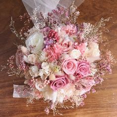 a bridal bouquet with pink and white flowers