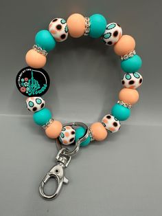 Raise your hand if you are tired of searching in your purse for your keys!  Or if you hate the juggle of your keys being in the wrong pocket and your hands are full!   These bracelet keychains are saving me headaches & eliminating the juggle! The keychain is made of high quality, non-toxic, BPA free silicone beads. Attached to a metal ring and lobster clasp to easily attach to your keys. The wristlet is designed to easily slip onto your wrist, and is the perfect size that it will stay there until you want it off!  No slipping off thanks to the "grippy" silicone beads!  You can then easily reach your keys to unlock the car or house door, but still keep them out of the way and your hands free. CHARM DETAILS: * Silicone Beads * Nylon Cord / Non Elastic / Not Stretchy * Swivel Snap Hook and Ri Bracelet Keychains, Key Accessories, Wristlet Keychain, Hands Free, Bring Happiness, Silicone Beads, Metal Rings, Skeleton, Key