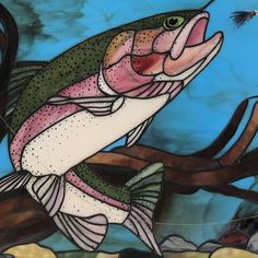 a painting of a fish on a tree branch