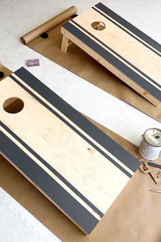 two pieces of wood sitting on top of cardboard