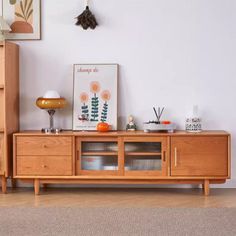 a living room scene with focus on the entertainment center and cabinet in the foreground