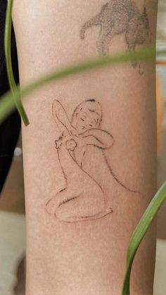 a woman's arm with a drawing on it