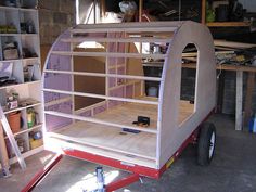 a small trailer with shelves on the side