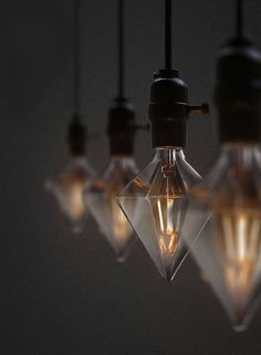 a bunch of light bulbs hanging from a ceiling