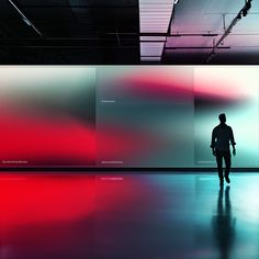 a man is walking in front of a wall with red and blue colors on it