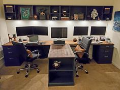 an office with two desks and three chairs in front of the desk is full of computer screens