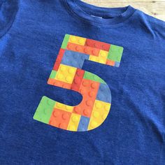 the number five is made out of legos on a blue t - shirt that says 5