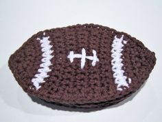 a crocheted football is sitting on a table