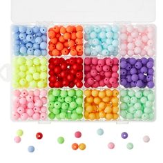 an assortment of beads in a plastic container