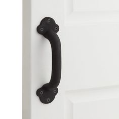 a black door handle on a white door