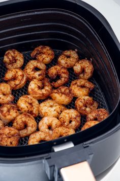 shrimp being cooked in an air fryer